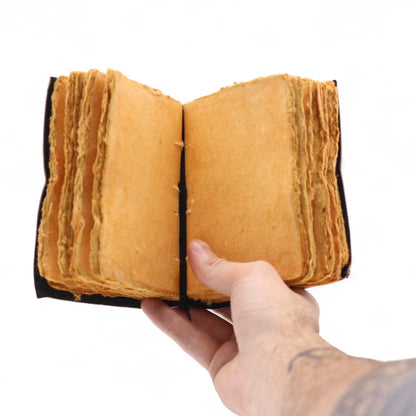 Deckled Edge Leather Notebook – 9x13 CM - The Stories I Tell Myself open leather notebook with deckled-edge pages held in hand