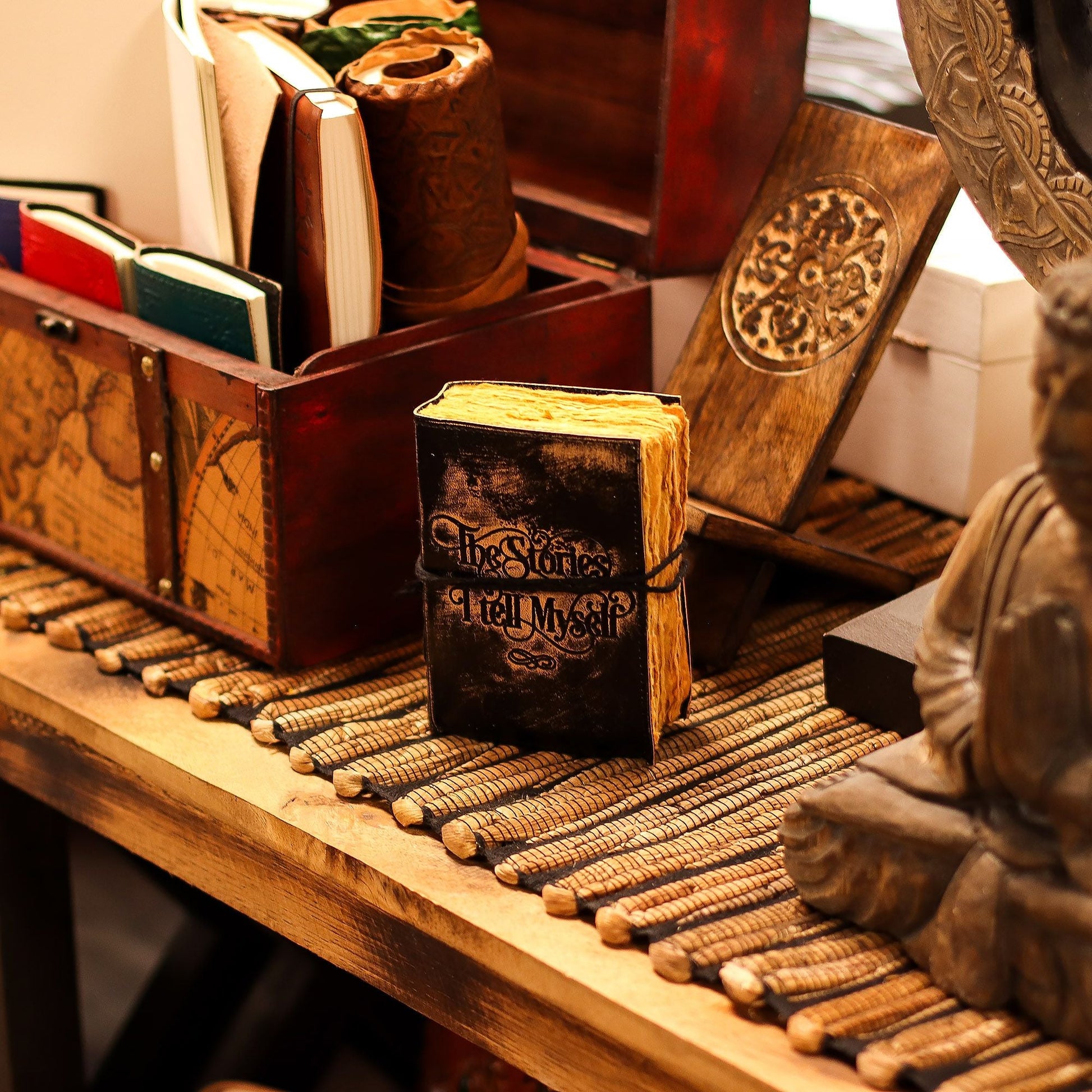 Deckled Edge Leather Notebook – 9x13 CM - The Stories I Tell Myself on wooden desk with rustic decor and journals