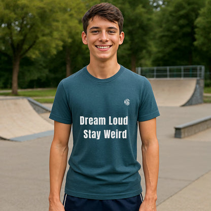 Alt Tag: Dream Loud. Stay Weird % Drix Sustainable Unisex Tee en azul con texto “Dream Loud Stay Weird” modelado en skatepark