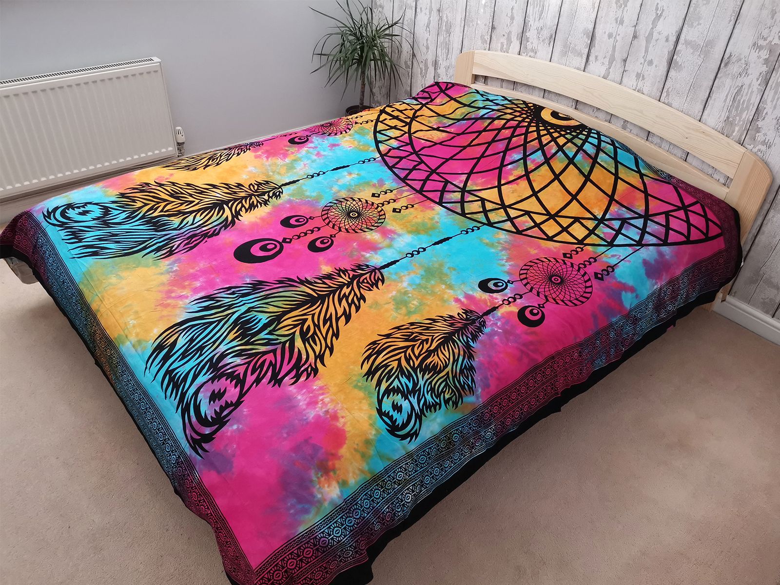 Alt Tag: Dreamchatcher Cotton Bedspread – 235x210 CM on bed, colorful tie-dye dreamcatcher and feather print cotton bedspread