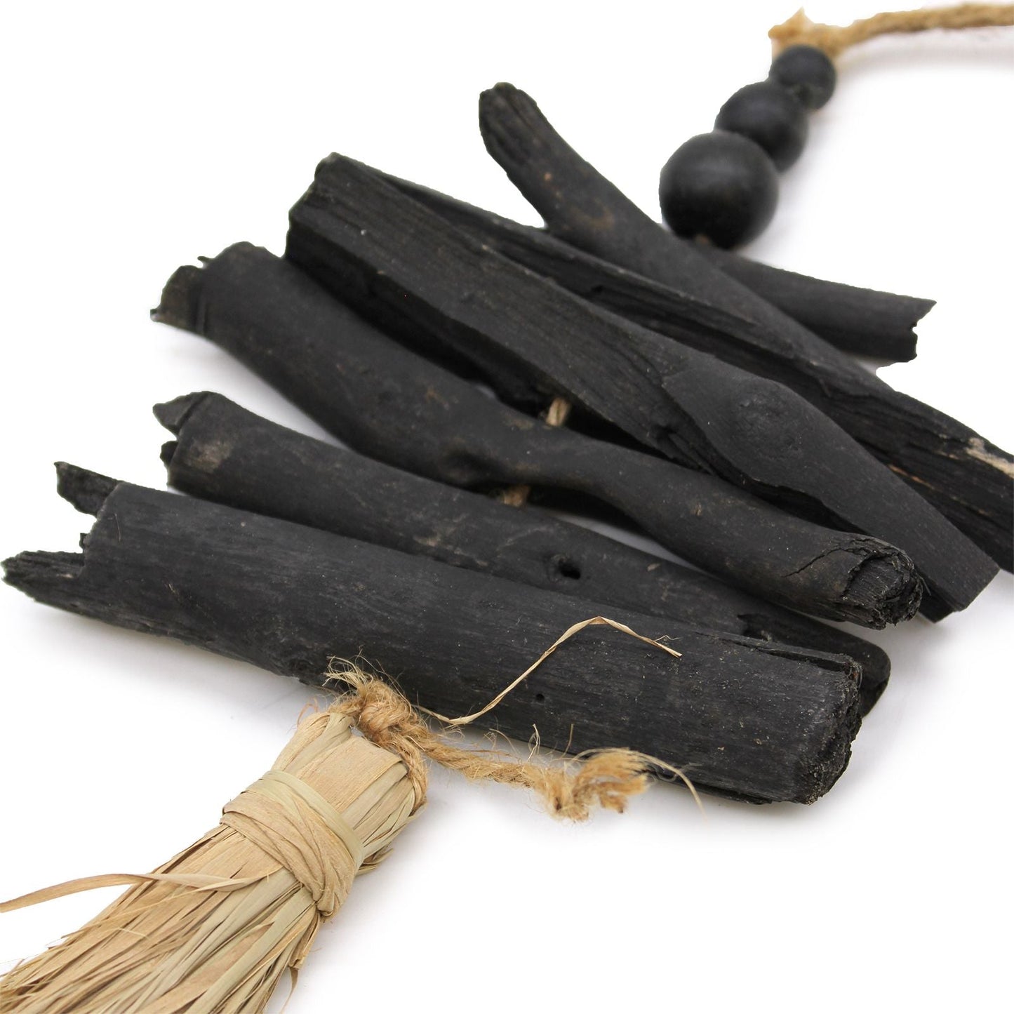 Driftwood & Seagrass Wall Tassel – 42 CM close-up of black driftwood sticks with natural raffia tie and wood beads
