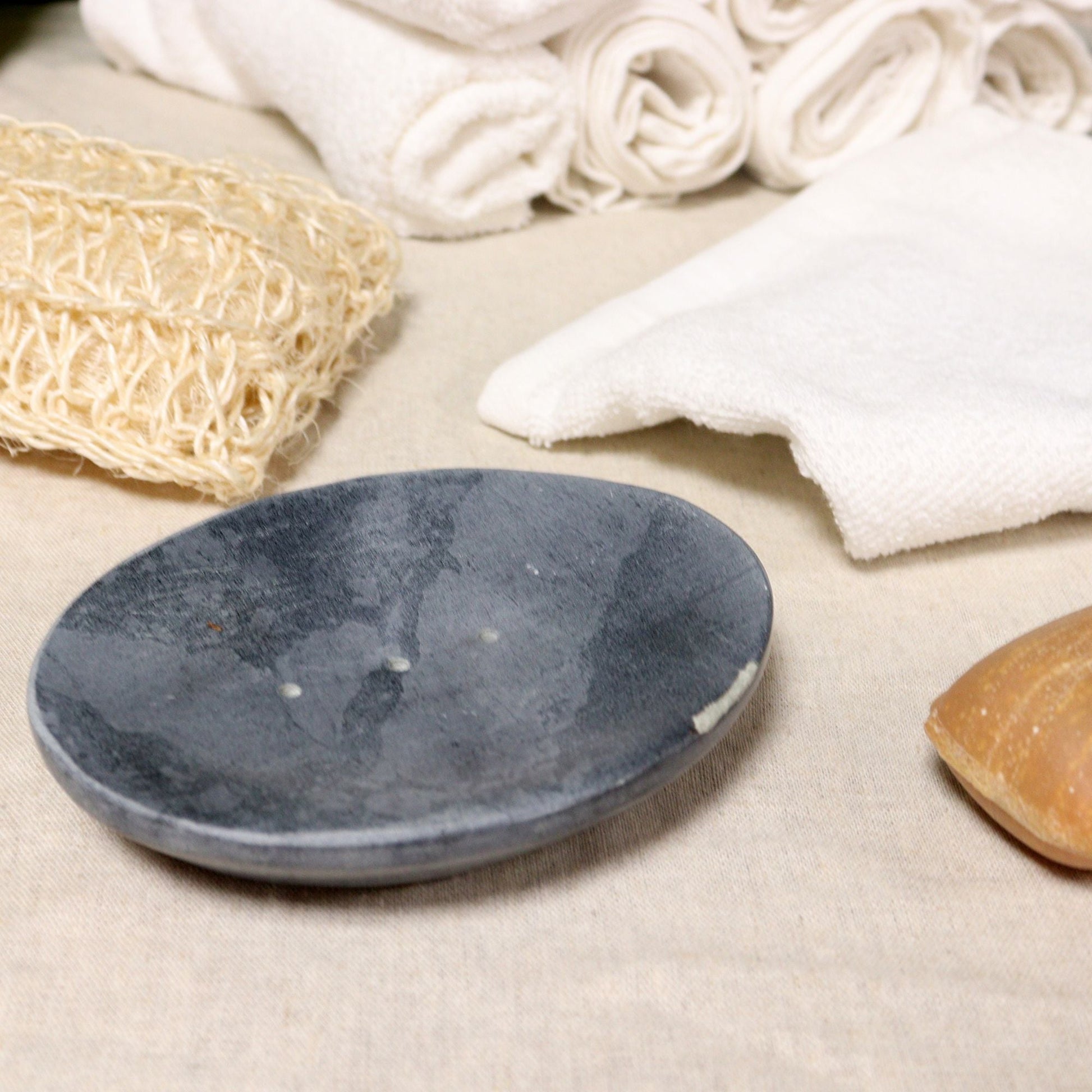 Alt Tag: Elegant Grey Soapstone Dish – 10x12CM Oval grey oval soapstone soap dish on bathroom counter with towels