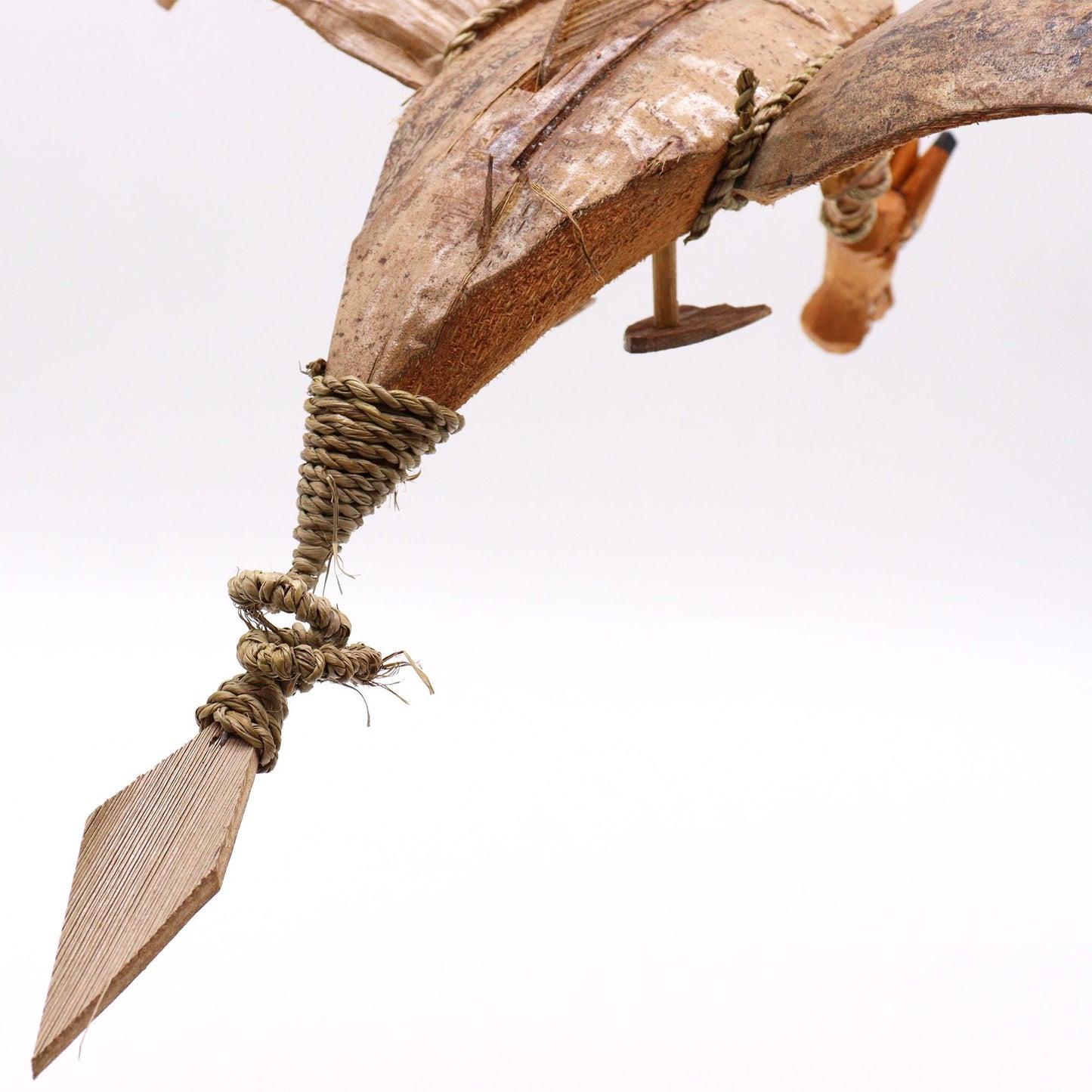 Alt Tag: Enchanting Coconut Dragon Mobile – 37 CM close-up of handmade coconut shell dragon wing and rope detail from Indonesia
