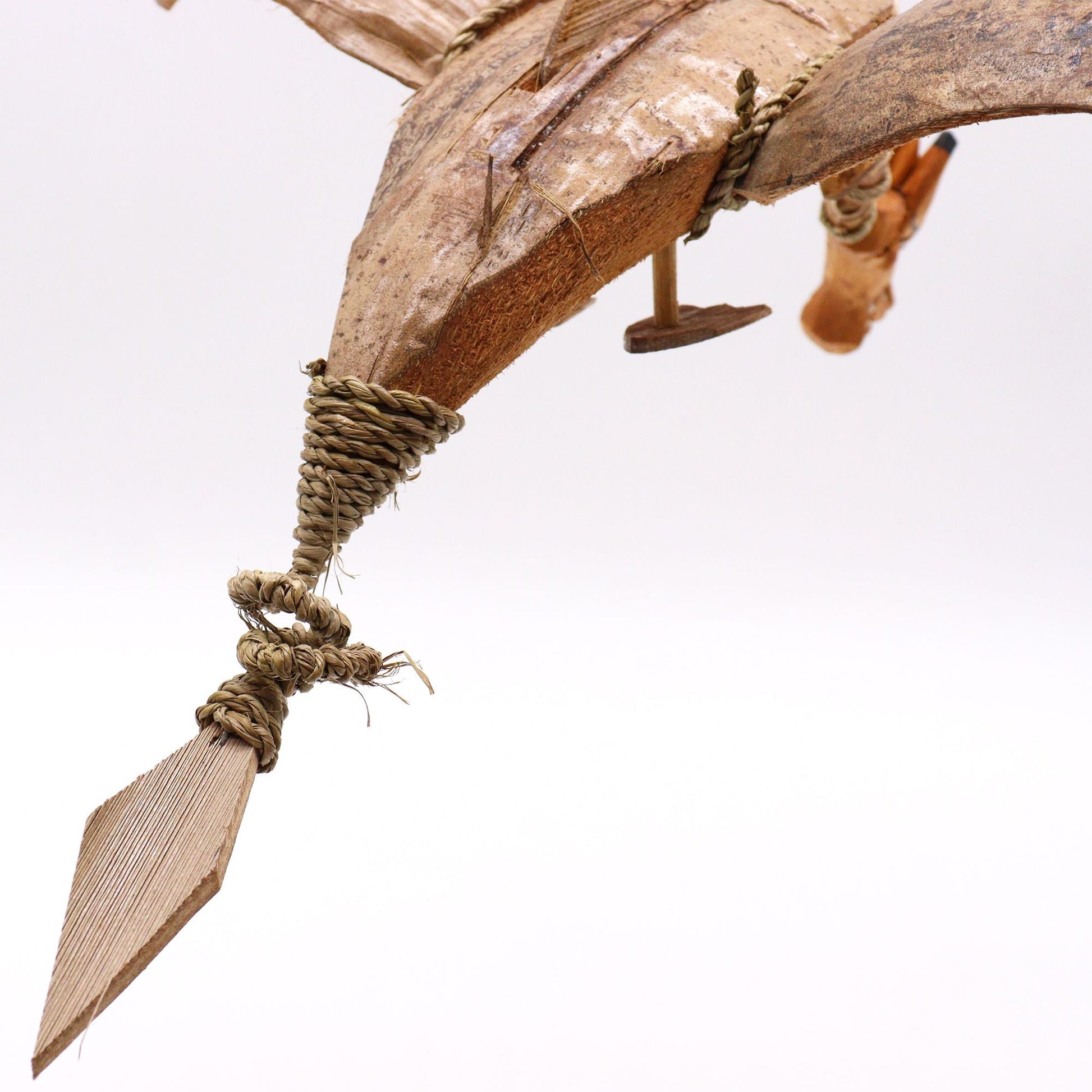Alt Tag: Enchanting Coconut Dragon Mobile – 37 CM close-up of handmade coconut shell dragon wing and rope detail from Indonesia