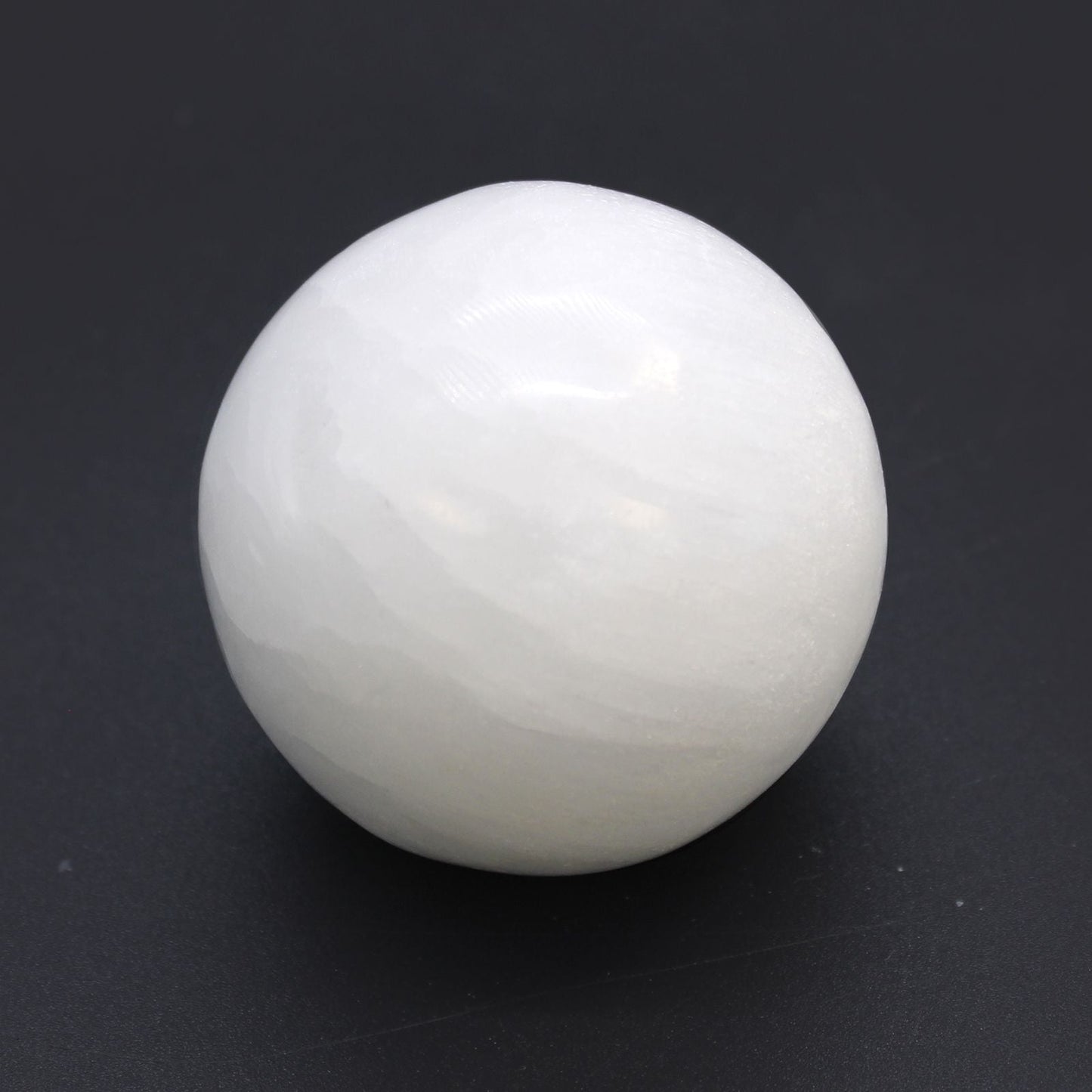 Alt Tag: Enchanting Selenite Sphere – 5 to 6 CM, natural white selenite crystal sphere 5.5 cm polished, for décor and meditation