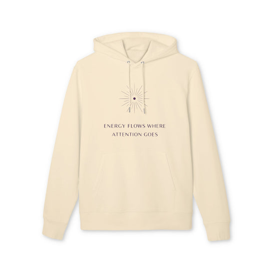 Energy Flows Yoga Hoodie 100% Organic Cotton en color crema, sudadera unisex con capucha y estampado “ENERGY FLOWS WHERE ATTENTION GOES”
