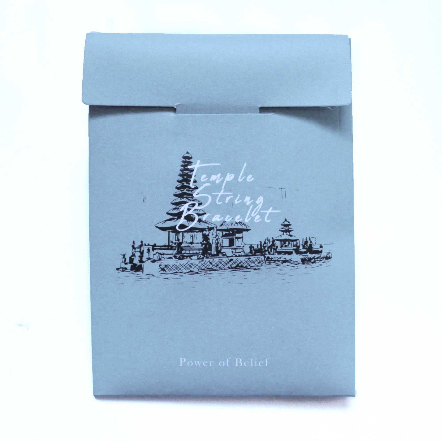 Enlightenment String Bracelet – Power of Belief packaging with temple illustration, premium handcrafted Indonesian string bracelet