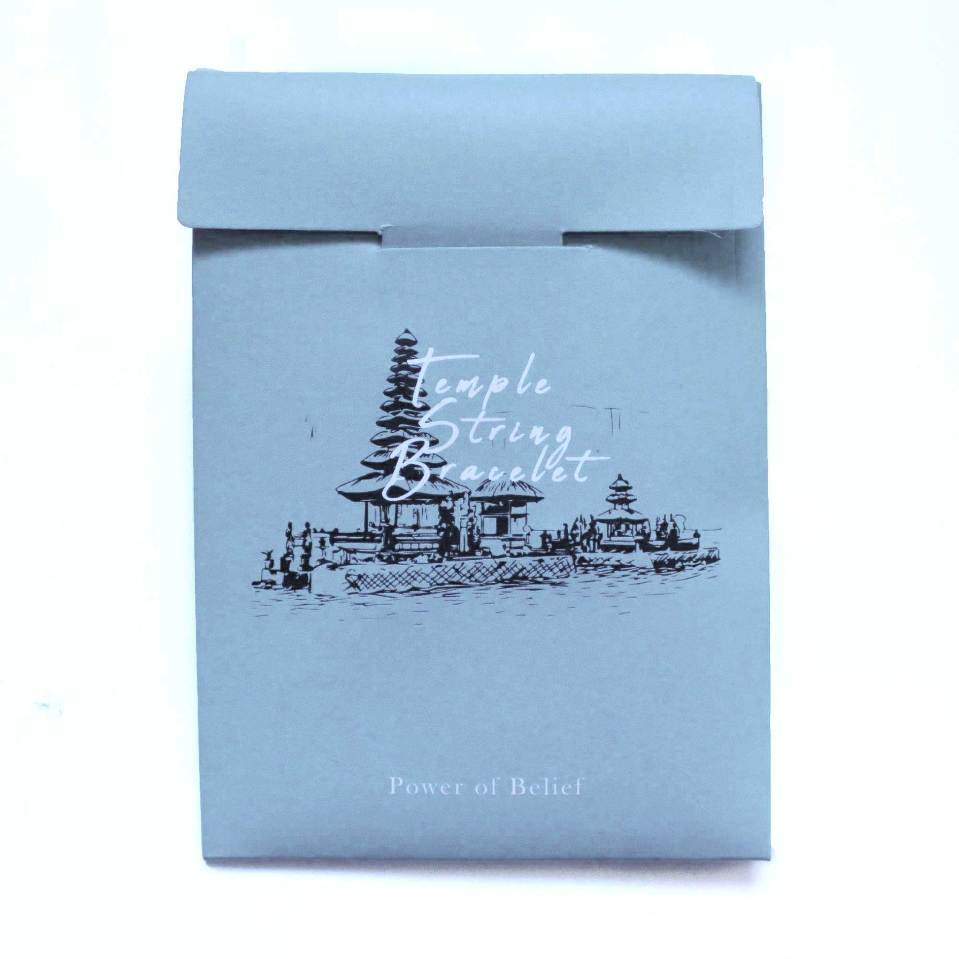 Enlightenment String Bracelet – Power of Belief packaging with temple illustration, premium handcrafted Indonesian string bracelet
