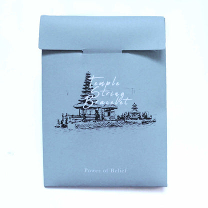 Enlightenment String Bracelet – Power of Belief packaging with temple illustration, premium handcrafted Indonesian string bracelet