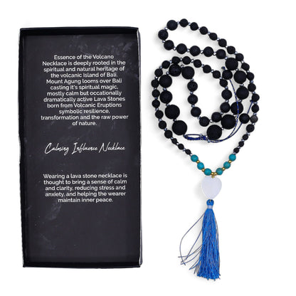 Essence of the Volcano Necklace – Calming Influence lava stone bead necklace with blue tassel and product box