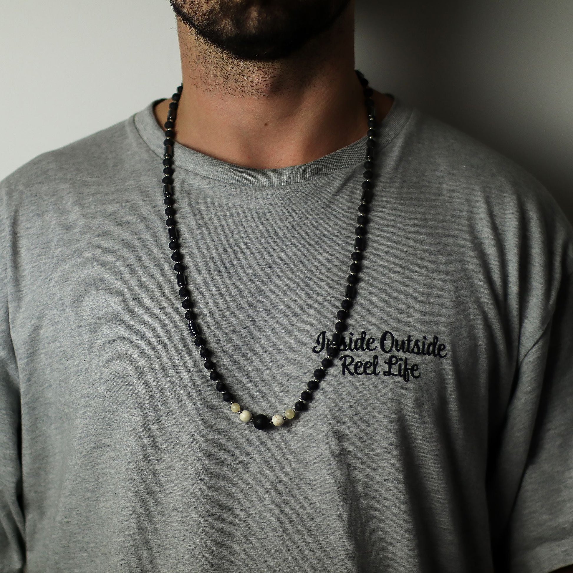 Essence of the Volcano Necklace – Cultural Connection (Handmade Origin Piece) on model, black volcanic lava stone bead necklace