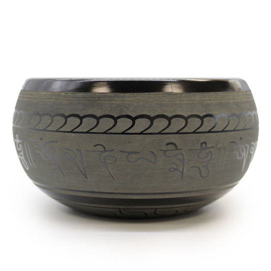 Extra Loud Singing Bowl – One Buddha bowl with etched mantra design, handcrafted metal singing bowl close-up on white background