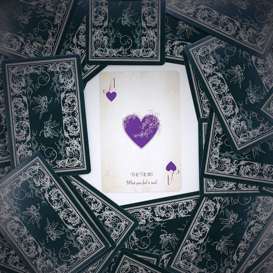 Alt Tag: Fae Realm Oracle Cards – 54-Card Deck spread with ornate black backs and central heart card, fairy-themed premium oracle deck