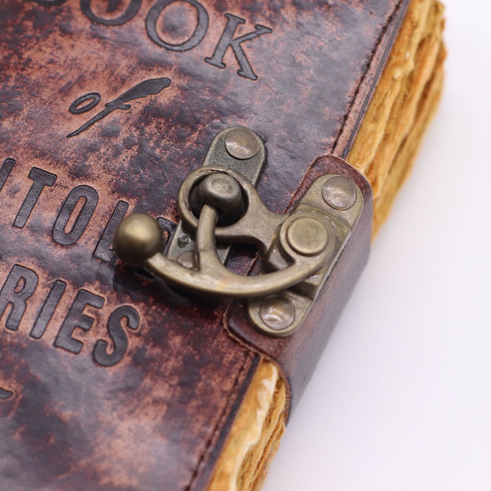 Fat Deckled Leather Notebook – 15.5x10 CM close-up of vintage leather cover with metal clasp and deckled paper edges