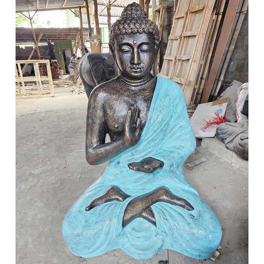 Fibre Cement Buddha Meditation Stupa – 1.5M seated Buddha statue with blue robe, hands in meditation mudra, workshop setting