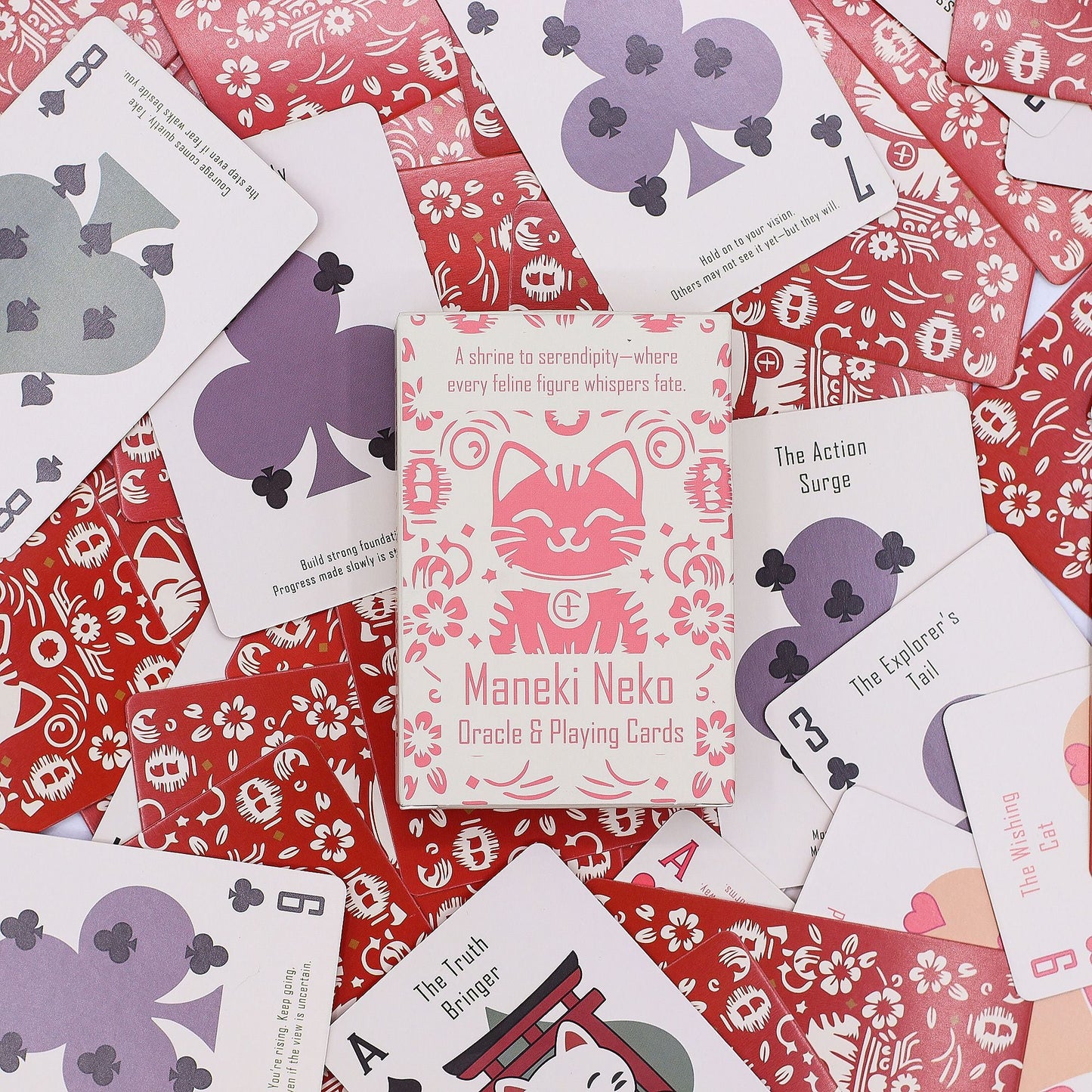 Fortune Cats Playing & Oracle Cards – Maneki Neko Deck with illustrated Maneki Neko box and playing-style oracle cards on red patterned background
