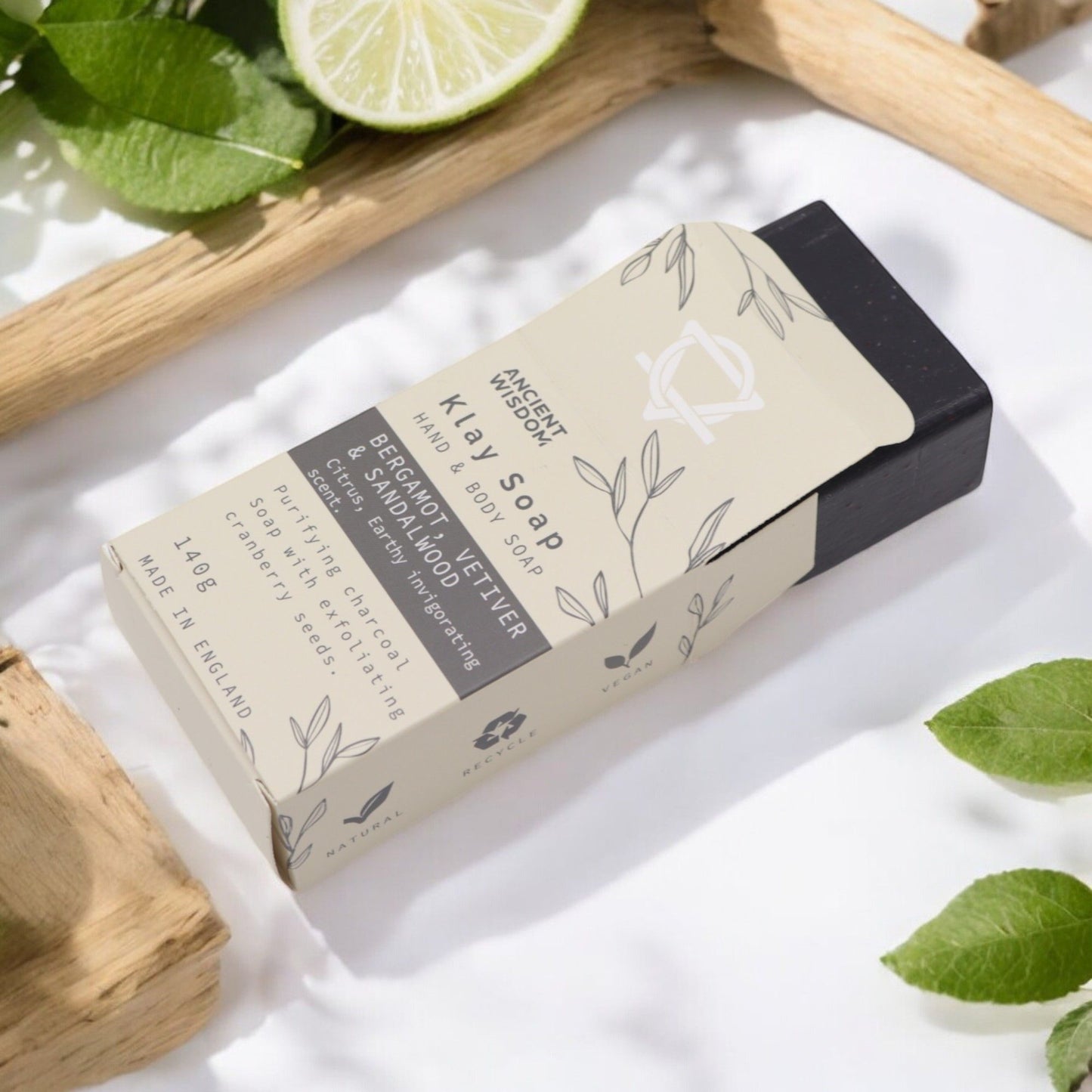 Fuller’s Earth Clay Soap – Bergamot & Sandalwood bar soap in kraft paper box with lime slice and green leaves