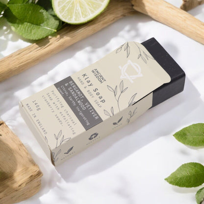 Fuller’s Earth Clay Soap – Bergamot & Sandalwood bar soap in kraft paper box with lime slice and green leaves