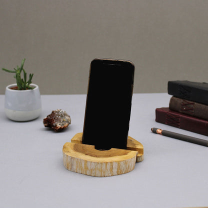 Alt Tag: Gamal Wood Phone Holder – Large Whitewash wooden smartphone stand with whitewash finish on desk with books and plant