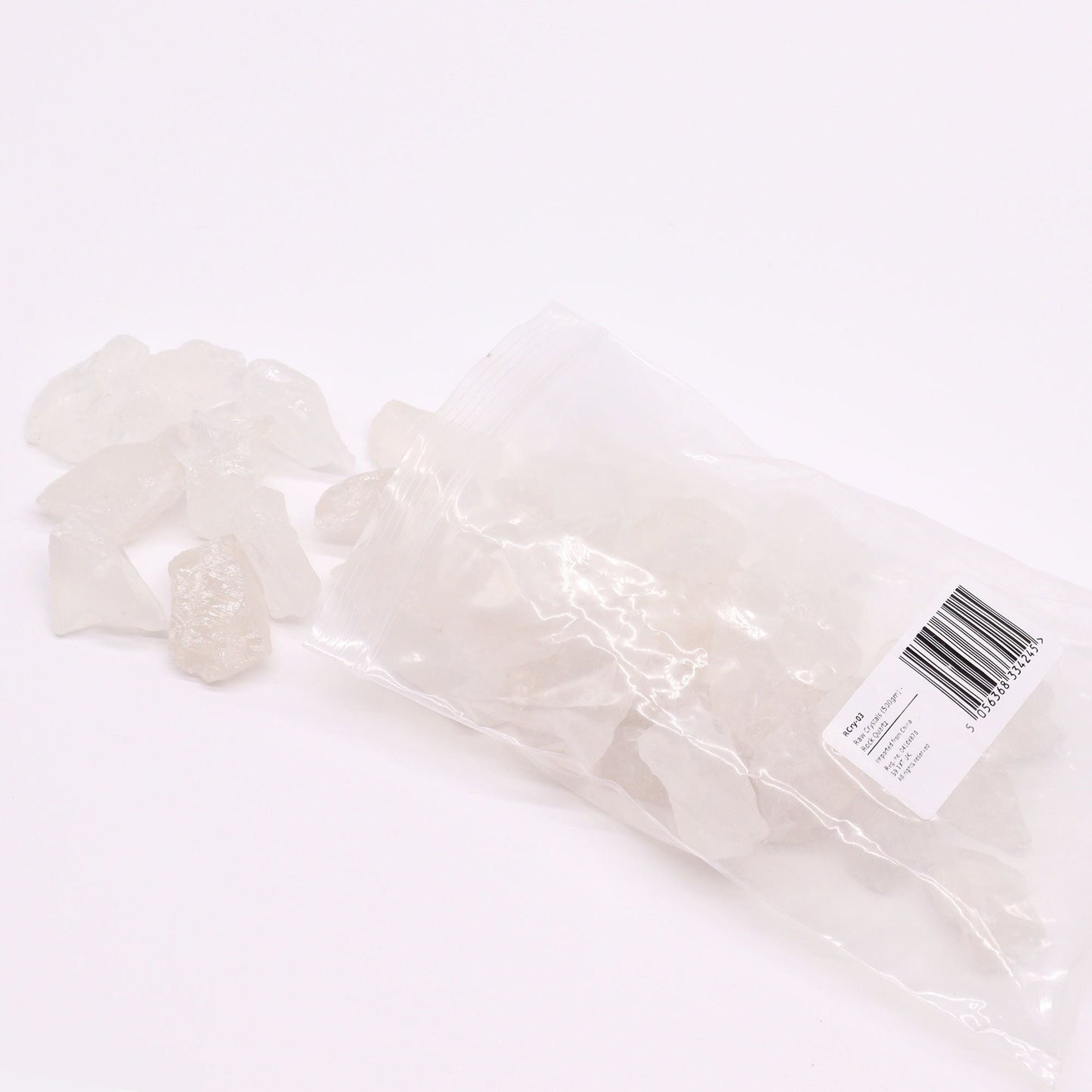 Alt Tag: Gemstone Raw Crystals – Rock Quartz 500G piedras de cuarzo roca en bruto, piezas translúcidas en bolsa transparente sobre fondo blanco