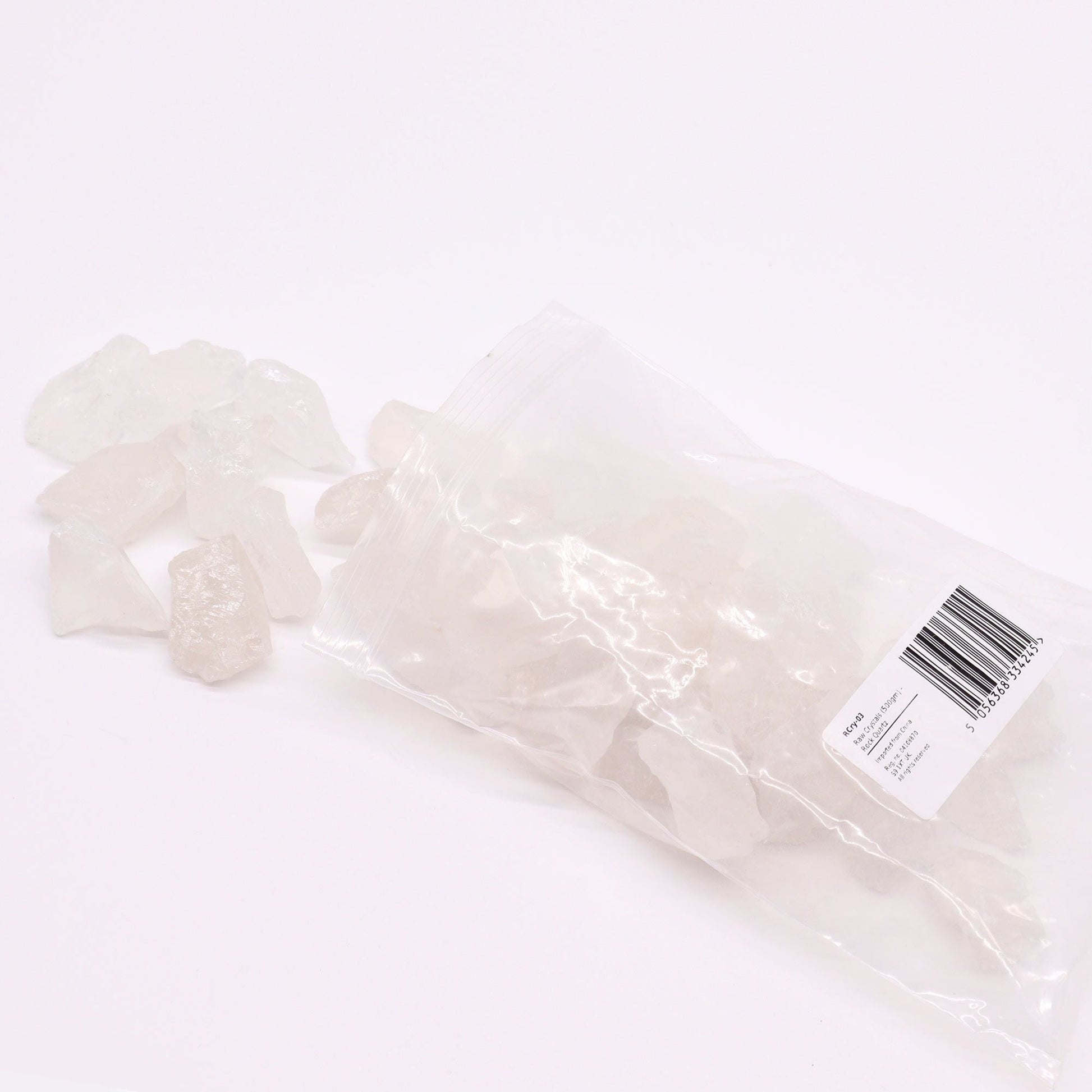 Alt Tag: Gemstone Raw Crystals – Rock Quartz 500G piedras de cuarzo roca en bruto, piezas translúcidas en bolsa transparente sobre fondo blanco