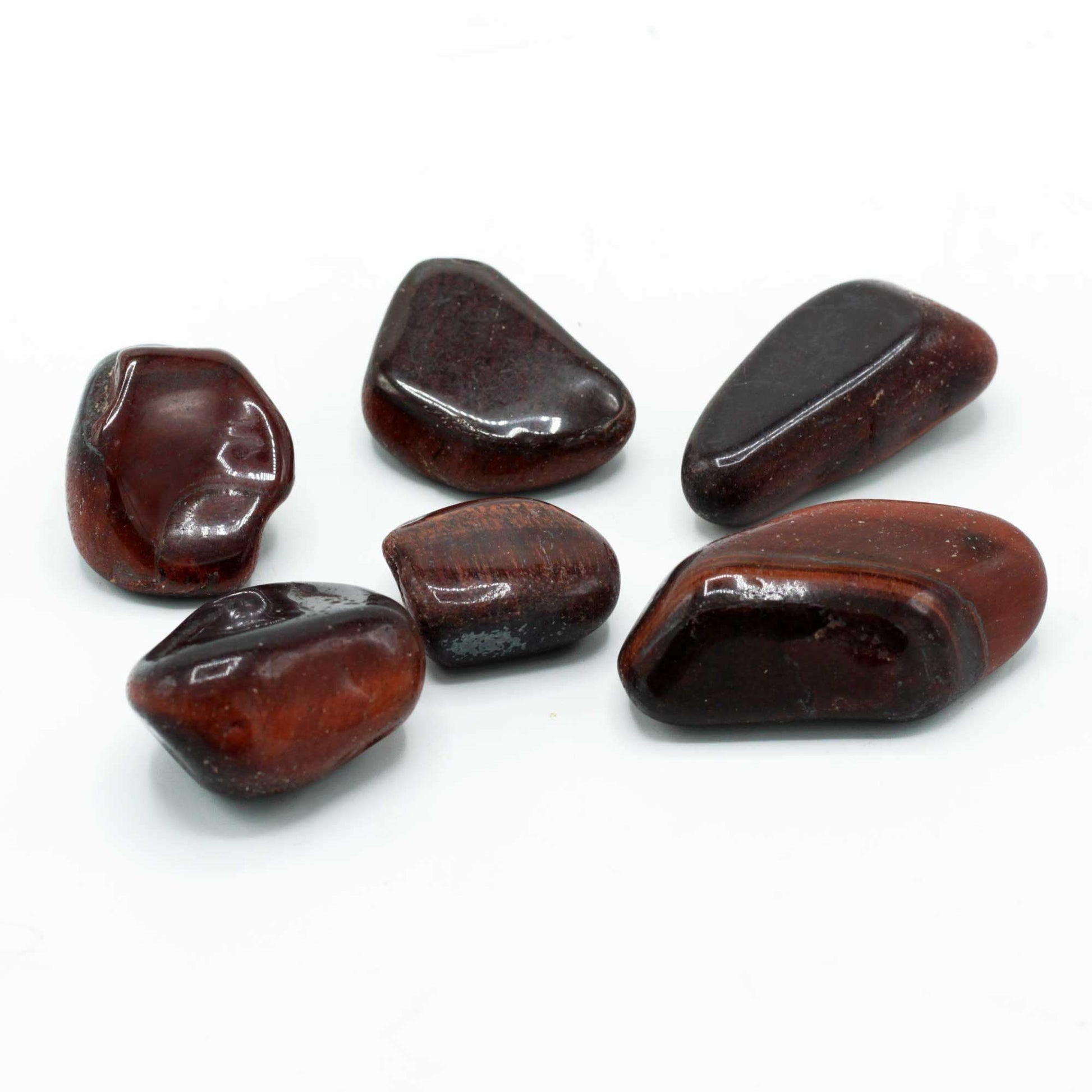Alt Tag: Gemstone Tigers Eye – Red Tumble Stone 30MM, polished red tiger’s eye tumble stones group on white background