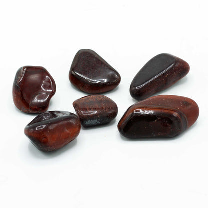 Alt Tag: Gemstone Tigers Eye – Red Tumble Stone 30MM, polished red tiger’s eye tumble stones group on white background