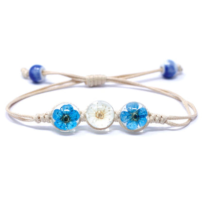Alt Tag: Glass & Floral Bracelet – Tri-Flower Design with real flowers in glass beads on adjustable cord bracelet, blue and white tri-flower