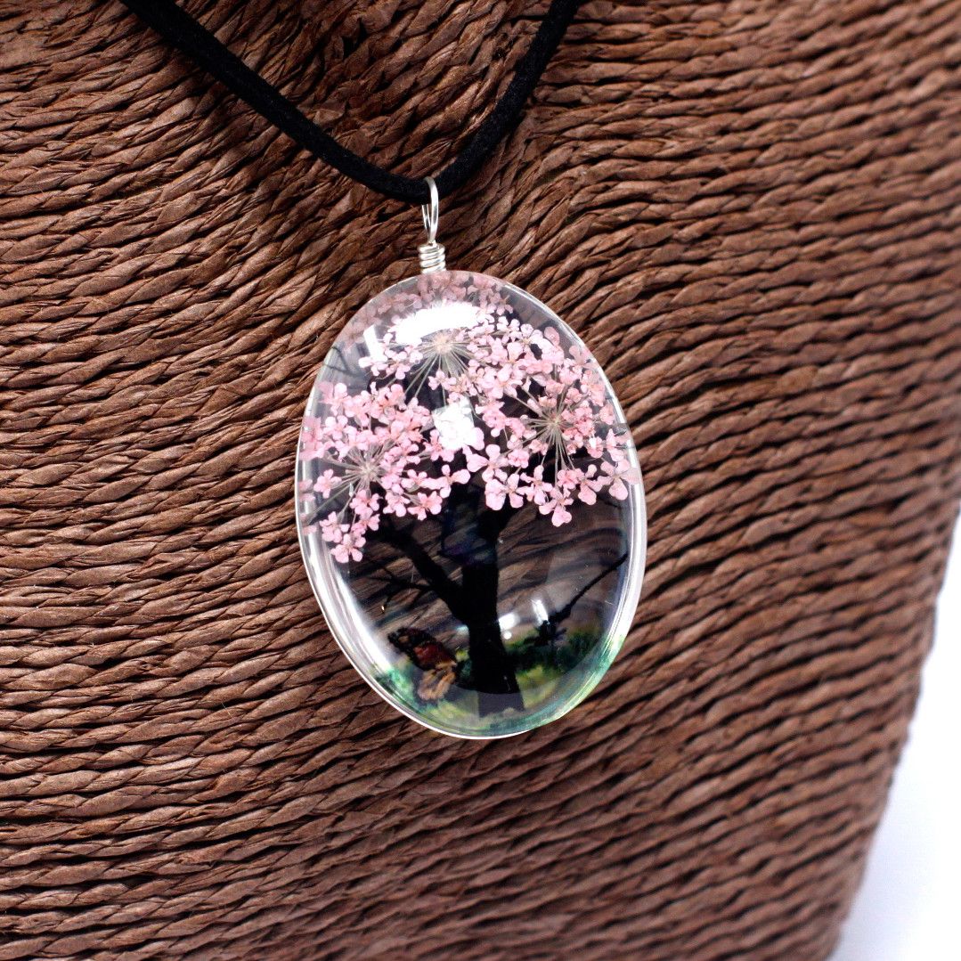 Alt Tag: Glass & Flowers Jewelry – Tree of Life, Pink pendant necklace with pressed pink flowers in glass oval charm on black cord