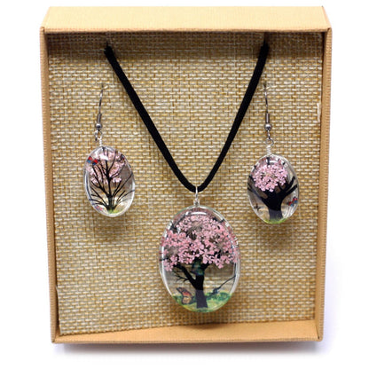 Alt Tag: Glass & Flowers Jewelry – Tree of Life, Pink set with glass pendant necklace and matching earrings featuring pressed pink flowers