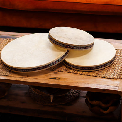 Goatskin Ocean Drum – 45CM Sound Harmonizer, ocean-style frame drums with goatskin heads on wooden table
