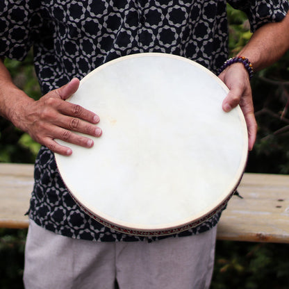 Goatskin Shamanic Ocean Drum – 35CM held by person outdoors, close-up of natural goatskin drumhead