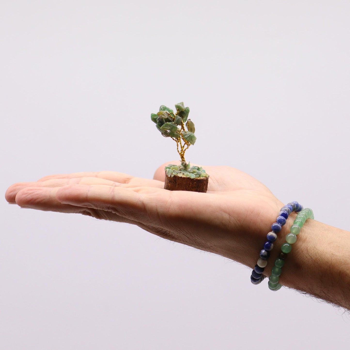 Alt Tag: Green Aventurine Gemstone Tree – 6CM, 15 Stones mini tree on wood base displayed on open hand, green stones, handmade in India