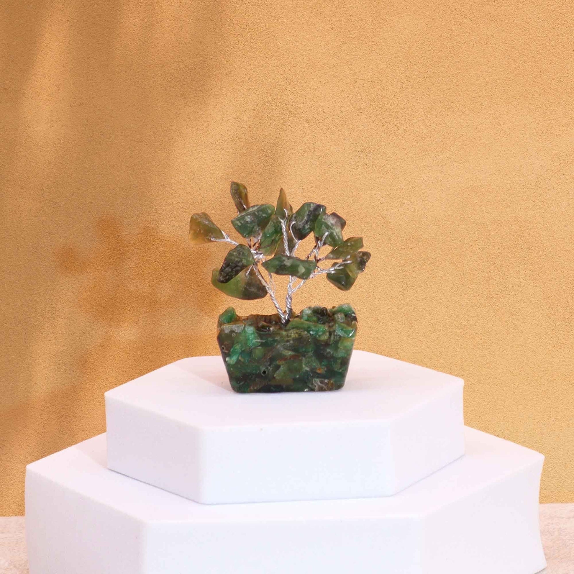 Alt Tag: Green Aventurine Mini Gemstone Tree – 15 Stones with orgonite base on white pedestal, green gemstone leaves decor