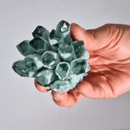 Alt Tag: Green Ghost Quartz Geode – 250-300G 8CM green quartz crystal cluster geode held in hand, 8cm specimen