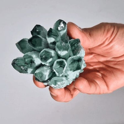 Alt Tag: Green Ghost Quartz Geode – 250-300G 8CM green quartz crystal cluster geode held in hand, 8cm specimen