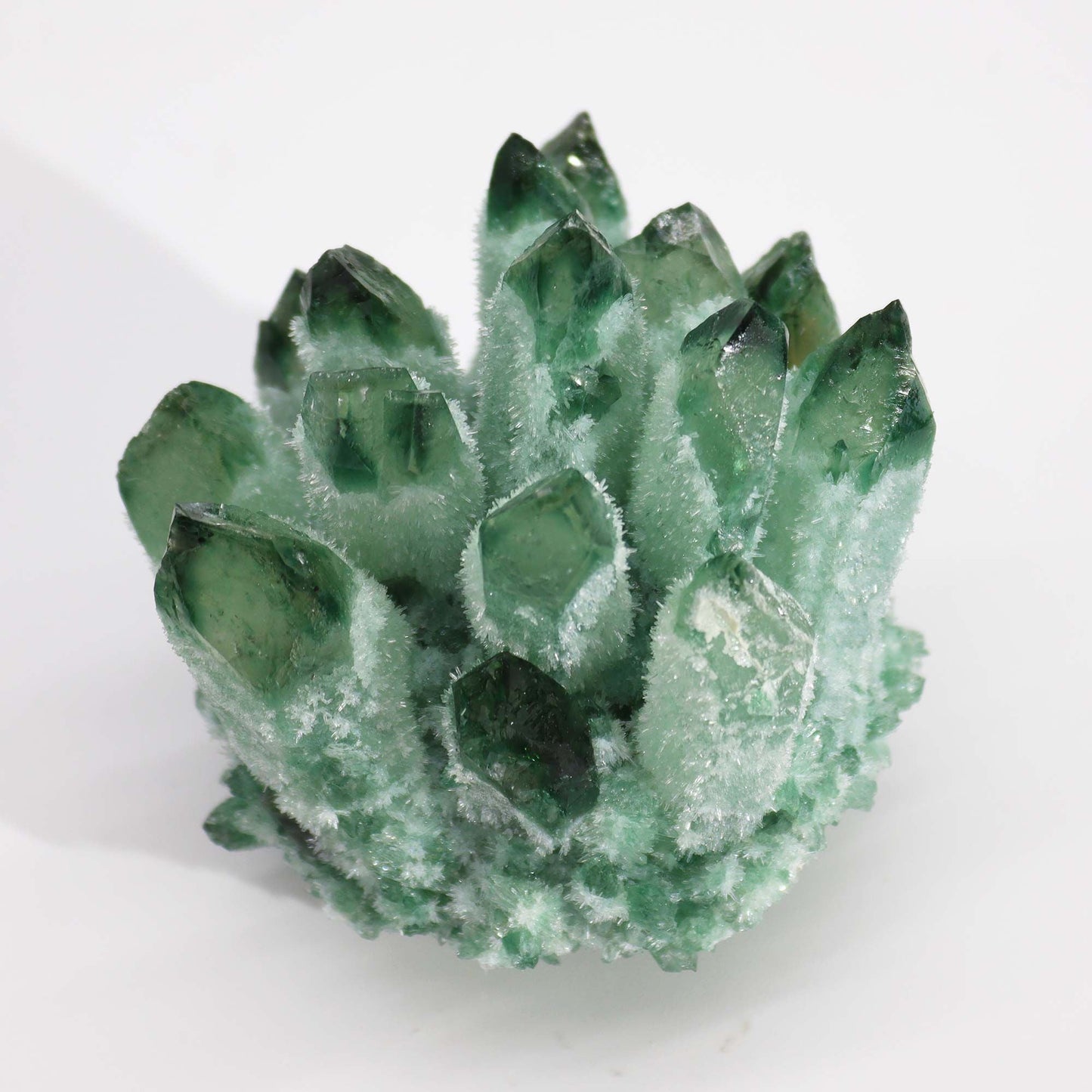 Alt Tag: Green Ghost Quartz Geode – 250-300G 8CM green quartz crystal geode cluster with dark green points on white background