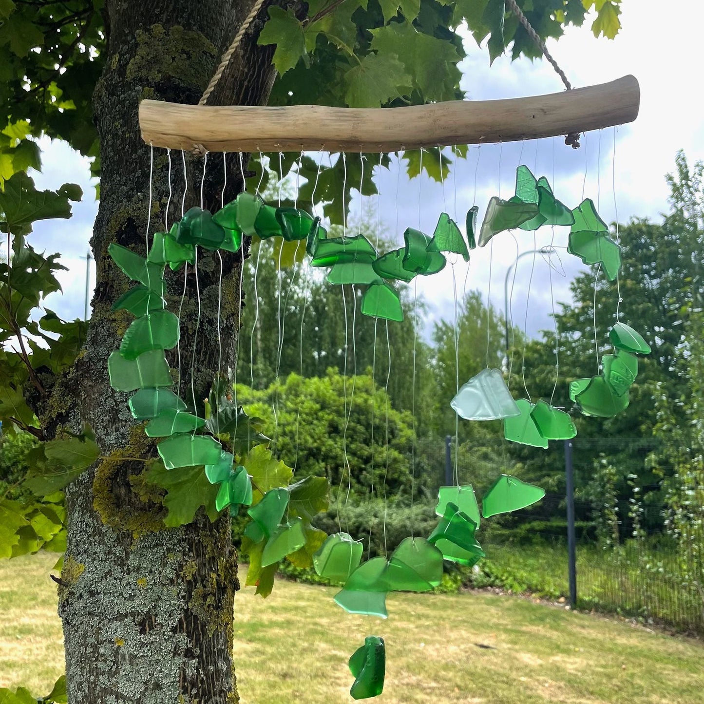Alt Tag: Green Recycled Glass Wind Chimes – 30x60 CM handmade recycled green glass and driftwood hanging wind chime outdoors