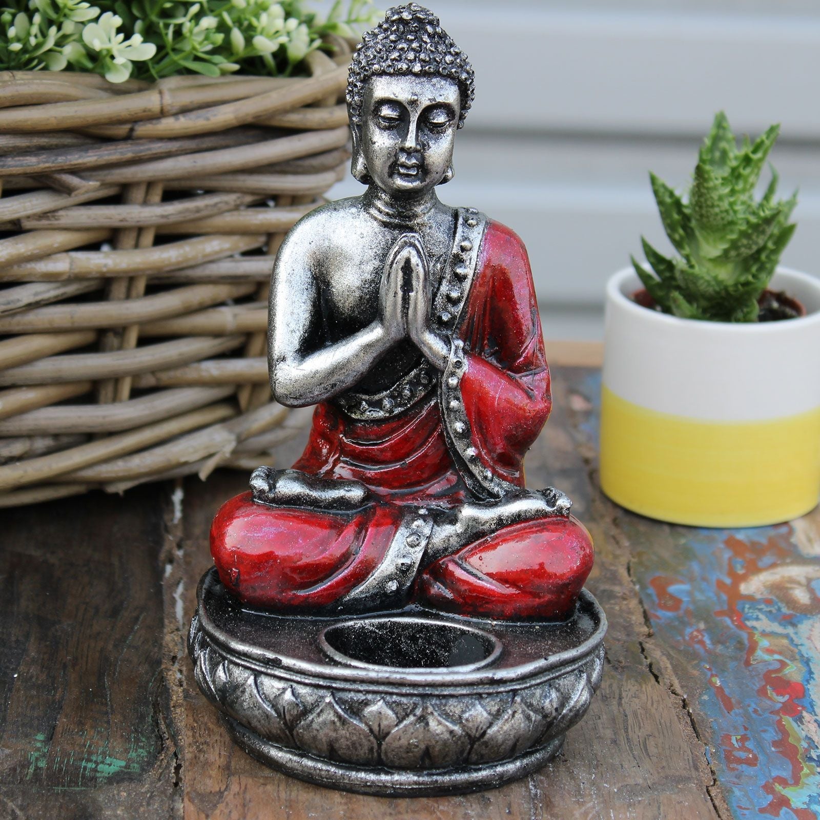 Alt Tag: Hand Painted Buddha Candle Holder – Red Medium resin Buddha in red and silver with tea light holder on rustic table