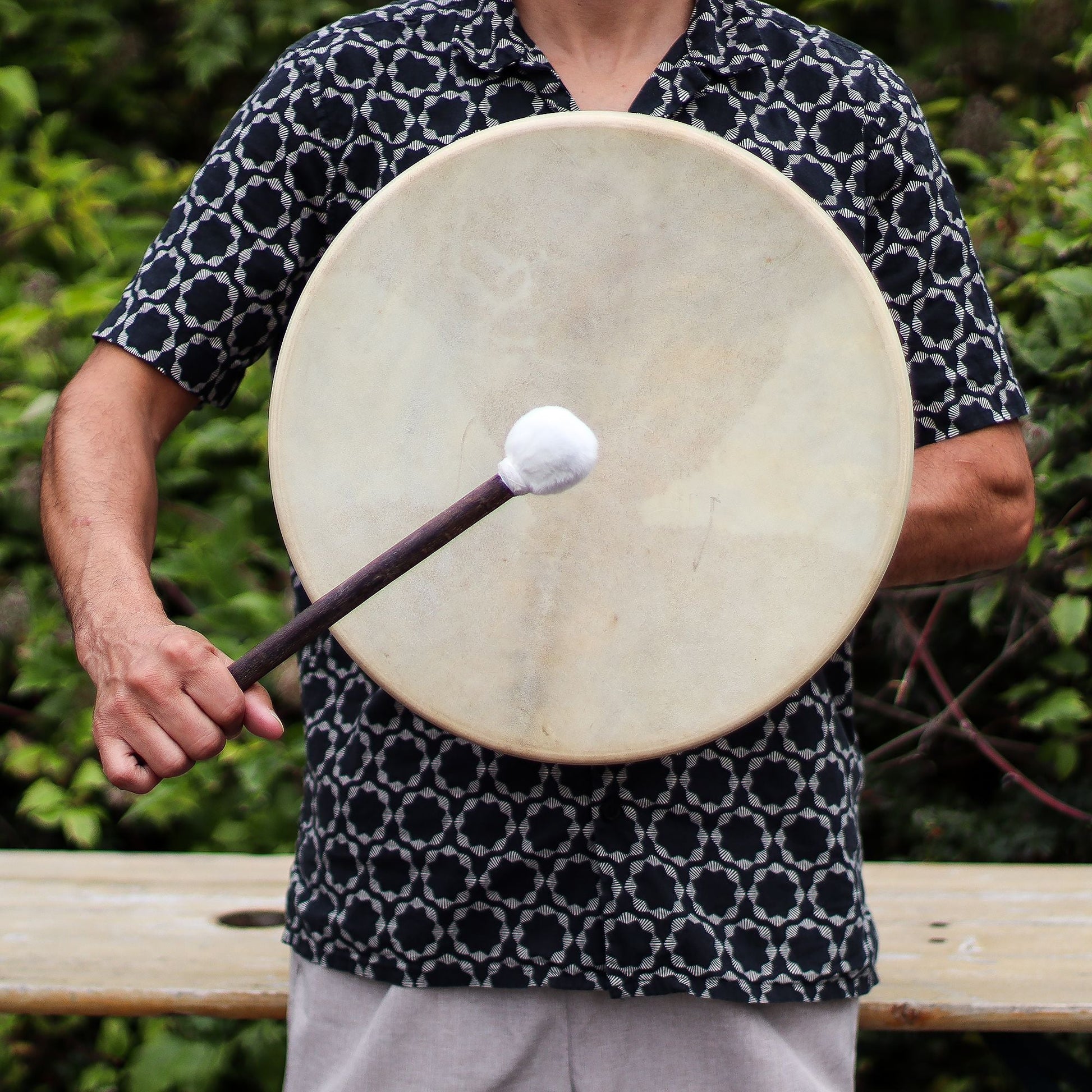 Alt Tag: Handcrafted Acacia Shaman Drum – 40 CM held by person with mallet, natural leather drumhead and acacia wood frame