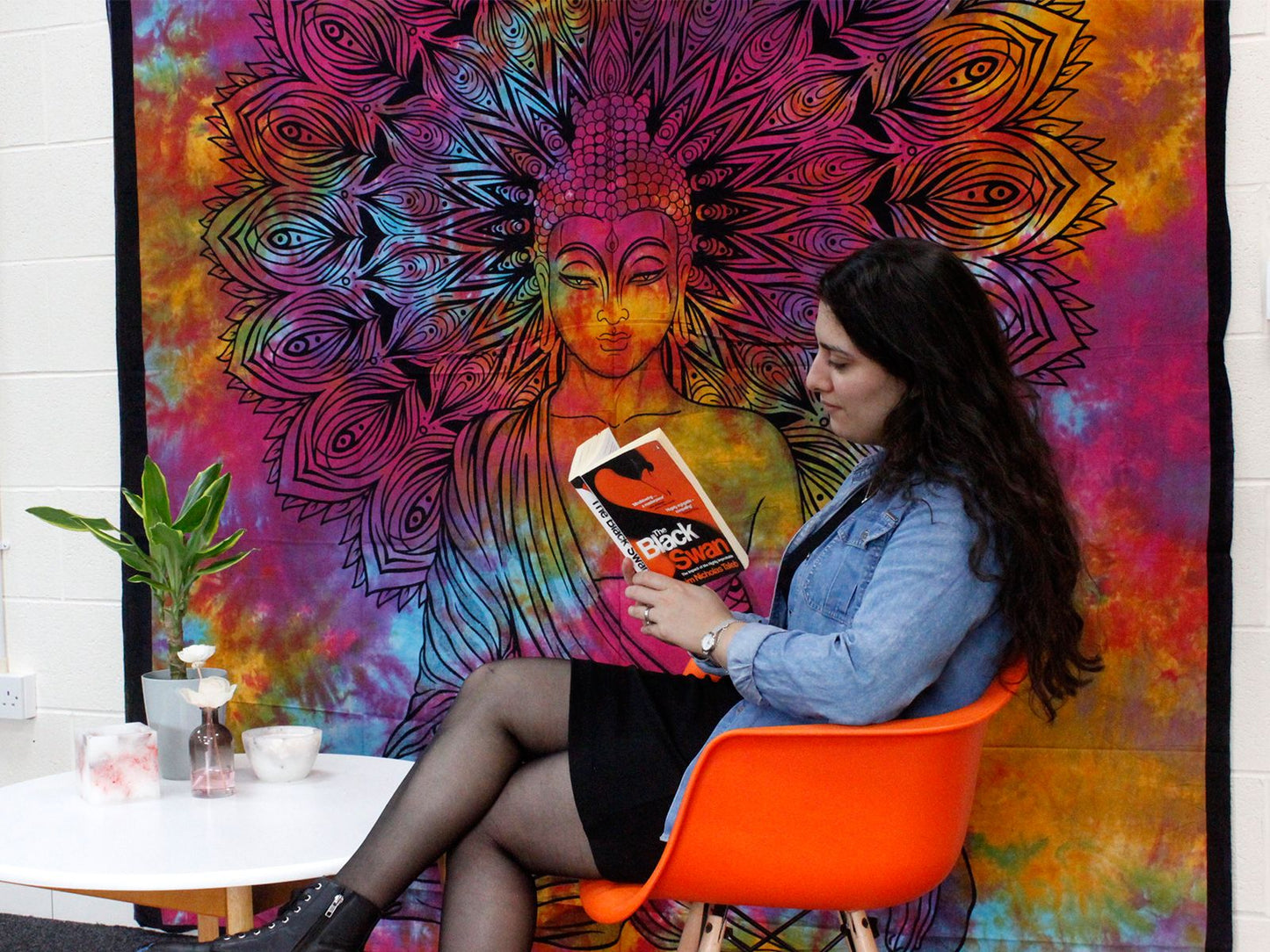 Handcrafted Cotton Bedspread – Bodhi Tree 230x200 CM colorful wall hanging behind woman reading in orange chair