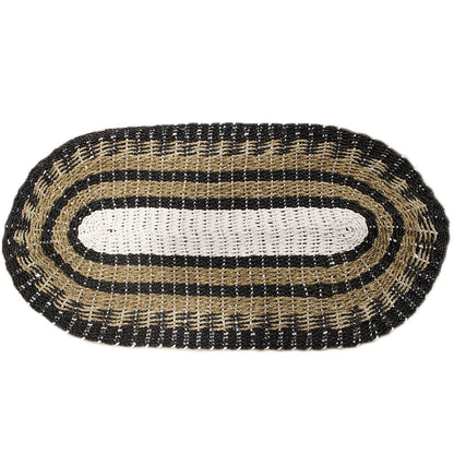 Alt Tag: Handwoven Seagrass Rug – Black & White Classic 60x120 CM oval braided seagrass rug in black, white and tan on white background