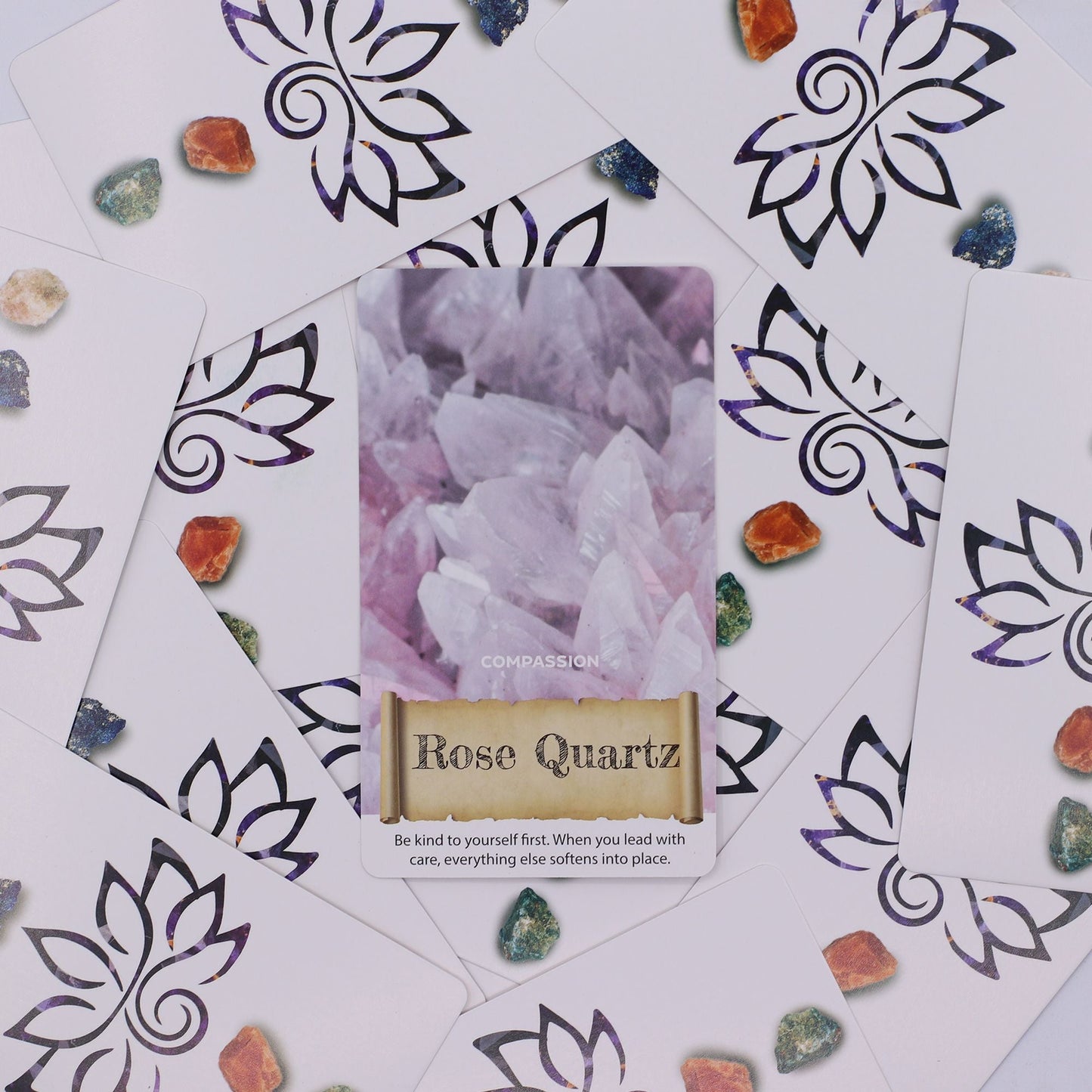 Harmonizing Energy Oracle Cards – Insightful Deck with Rose Quartz Compassion card, oracle deck cards and crystals on patterned background