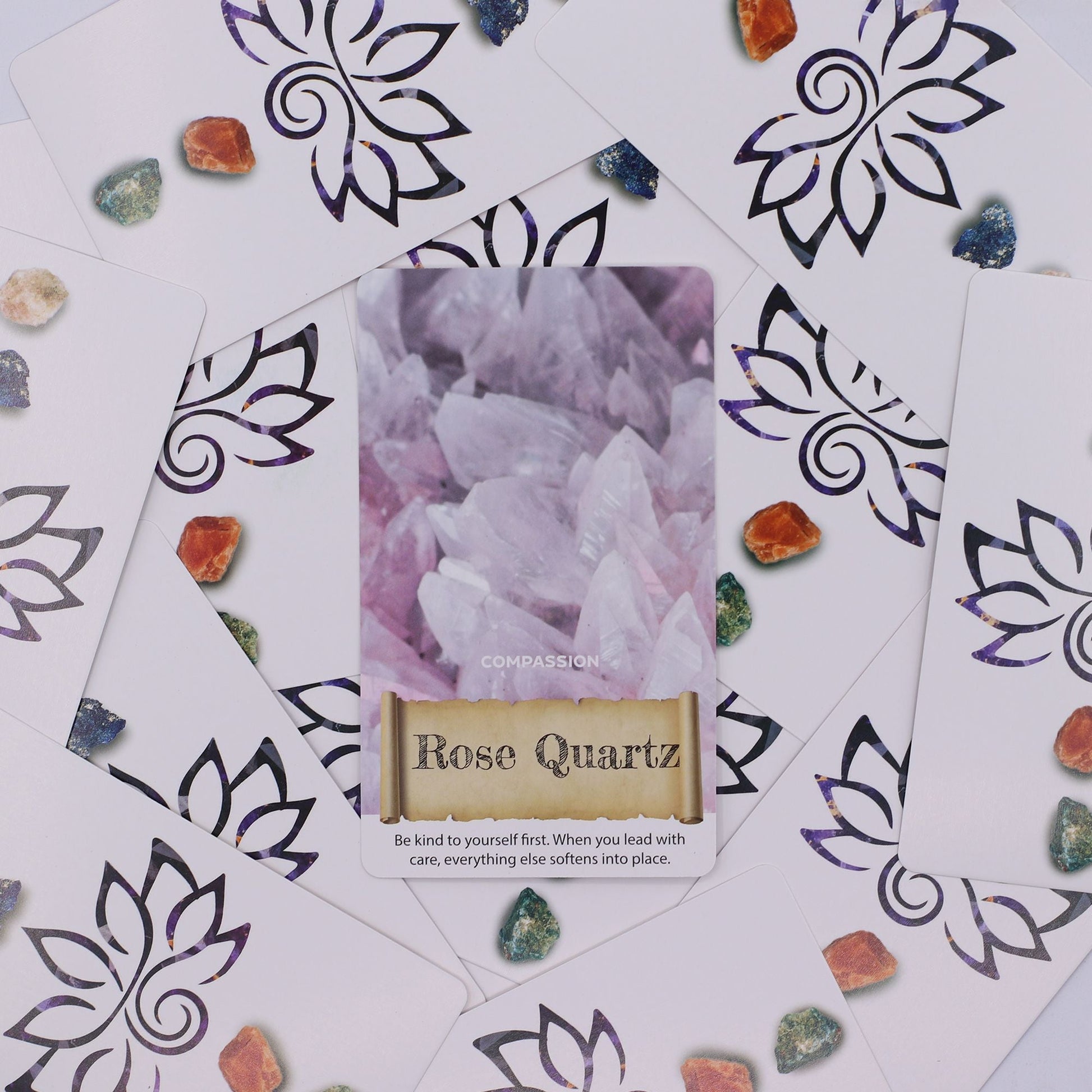 Harmonizing Energy Oracle Cards – Insightful Deck with Rose Quartz Compassion card, oracle deck cards and crystals on patterned background