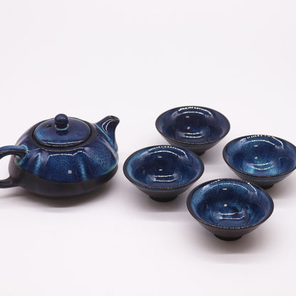 Alt Tag: Herbal Blues Teapot Set – Pot & Four Cups handcrafted blue ceramic teapot with lid and four matching cups, ocean-wave glaze