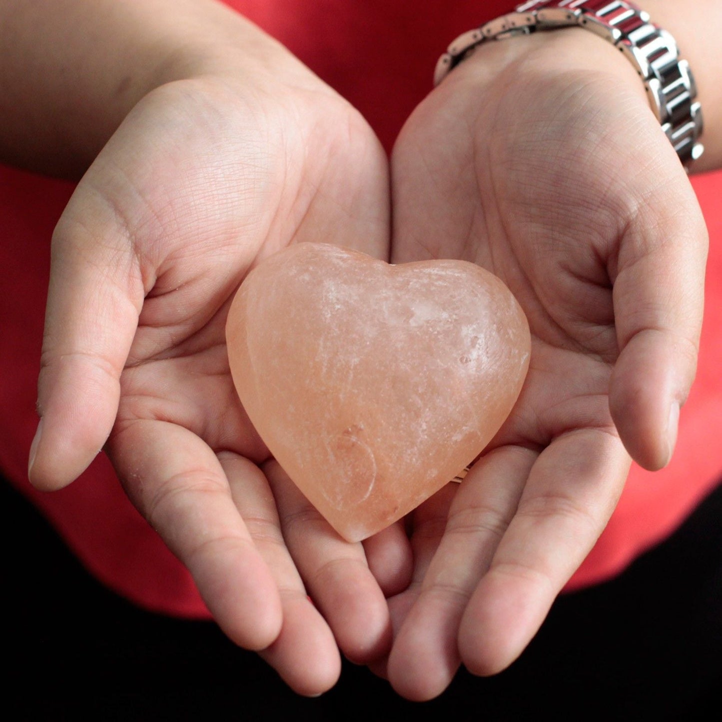 Alt Tag: Himalayan Heart Mineral Salt Deodorant – 7.5 CM heart-shaped Himalayan salt stone held in hands