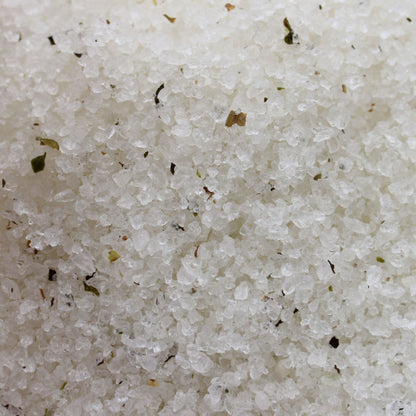 Alt Tag: Himalayan Mineral Bath Salt – 500G close-up of white mineral bath salt crystals with botanical specks, tea tree and lime scent blend