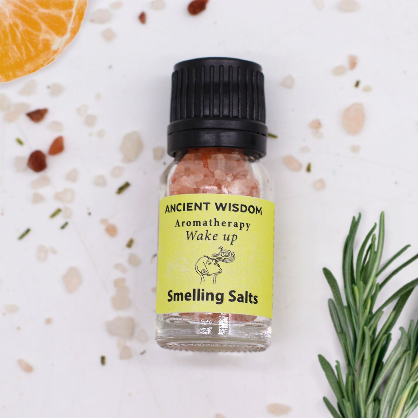 Alt Tag: Himalayan Salt Aromarelax  Smelling Salts – Wake-Up Blend bottle with pink salt crystals and rosemary on white surface