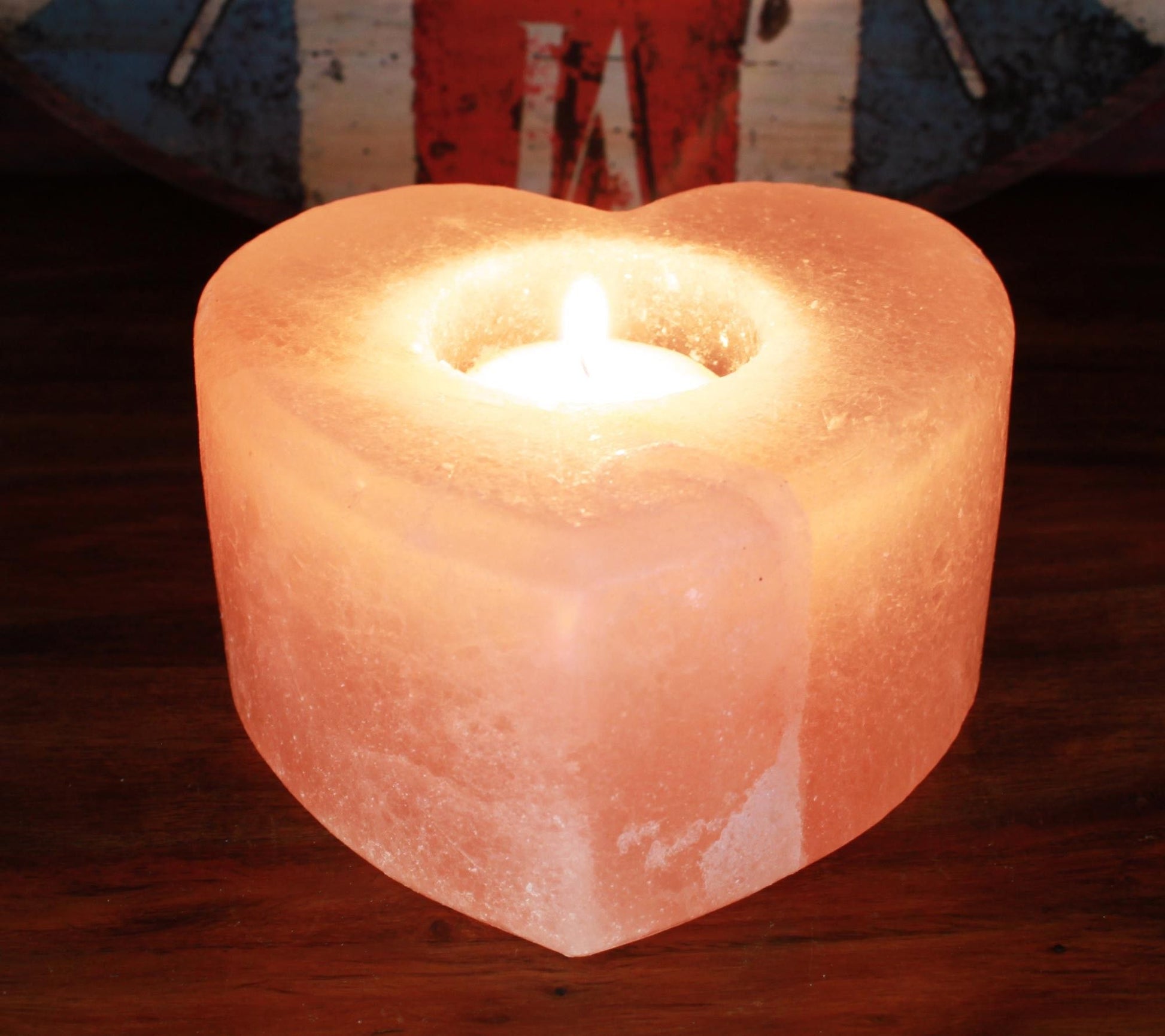 Alt Tag: Himalayan Heart Candle Holder – Medium heart-shaped Himalayan salt candle holder with lit tealight, warm amber glow, medium size 10x12x9 cm