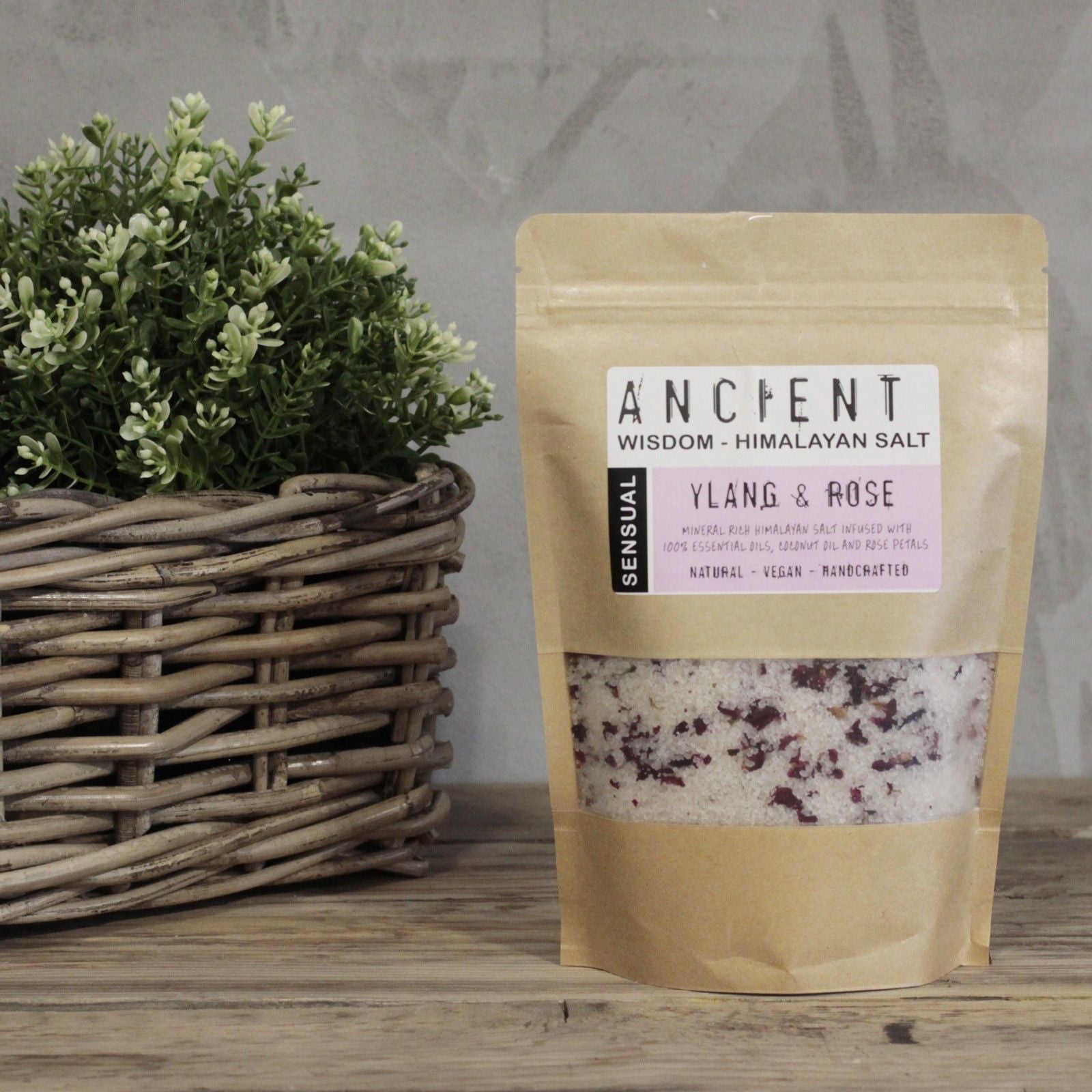 Himalayan Sensual Bath Salt – 500G Ancient Wisdom Himalayan salt bath salts pouch with ylang & rose on wooden table